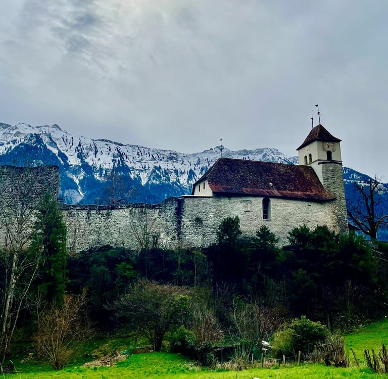 Looking up at Riggenberg Church and castle in Ringgenberg Switzerland outside of Interlaken