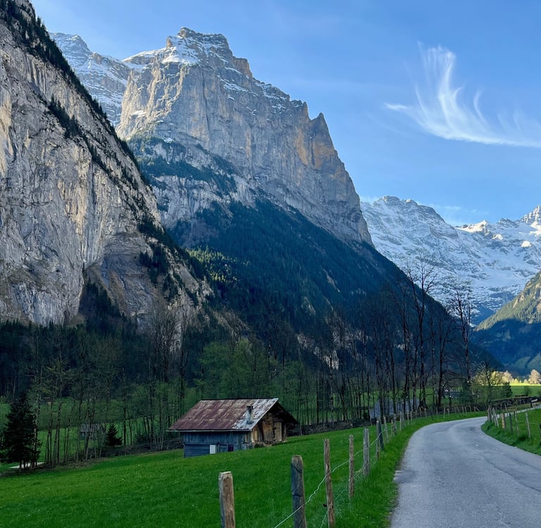 View looking up the Lauterbrunnen Valley in Switzerland with limestone cliffs towering above