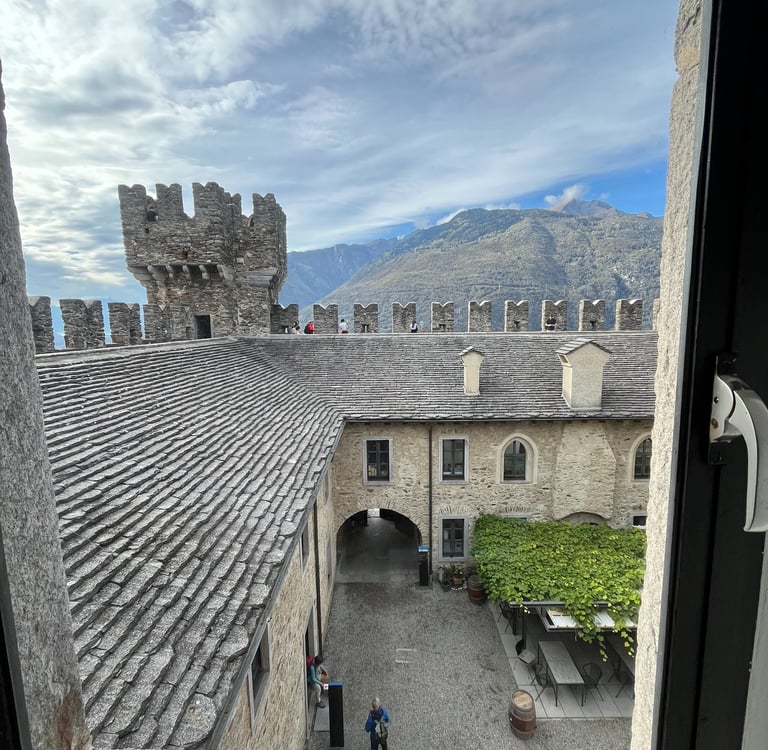 Looking out a window at the inner courtyard of Sasso Corbado