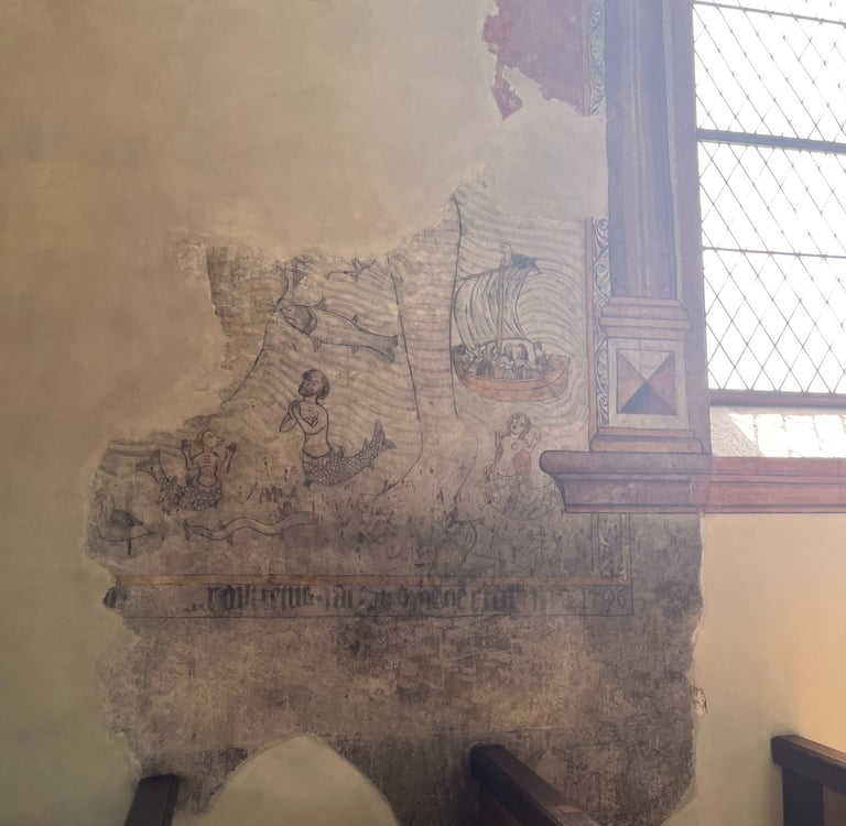 Mermaids in the frescos on the walls of the church in Leuk Switzerland