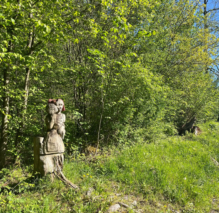 Wood carvings along the Entschlige river outside of Frutigen