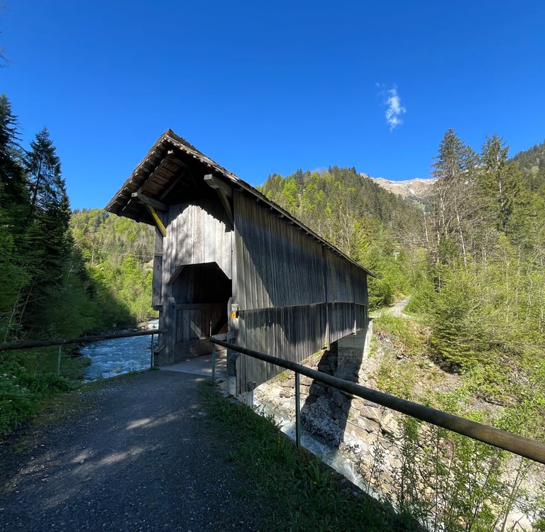 A covered bridge over the Entschlige River outside of Frutigen