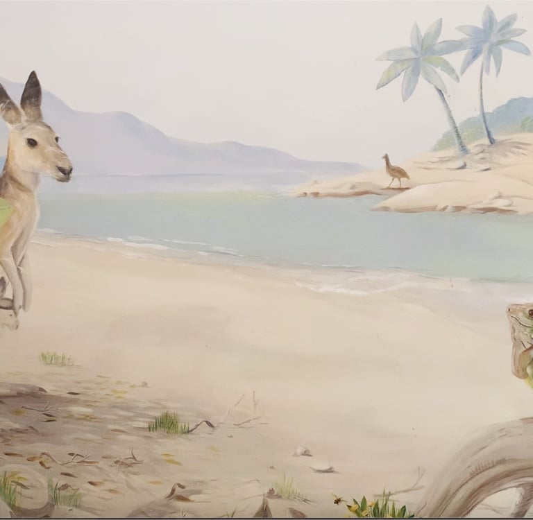 Hand-painted mural scene with kangaroos by the shore and an iguana basking in light—part of an Australian wildlife mural