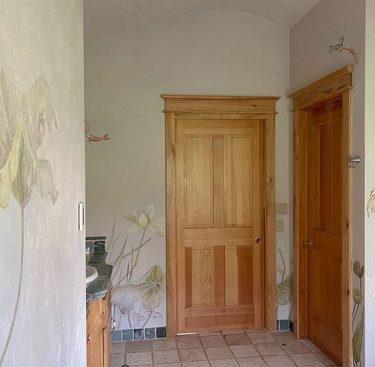 Luxury bathroom featuring painted murals of water lilies, koi and dragonflies in  watercolour and an Asian touch