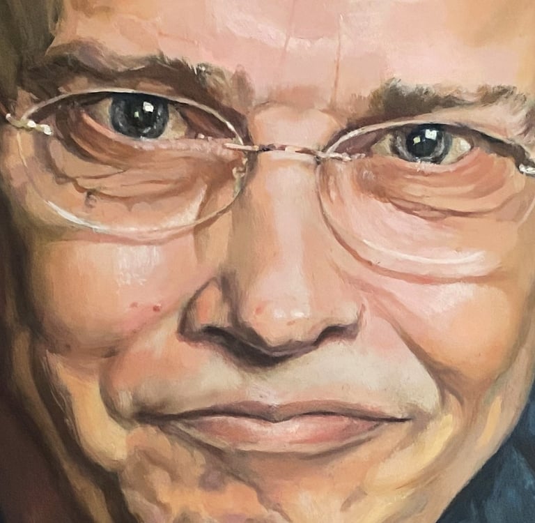 Detail of an oil-painted male portrait, focusing on expressive eyes and a smile—a study of warmth, intelligence and character