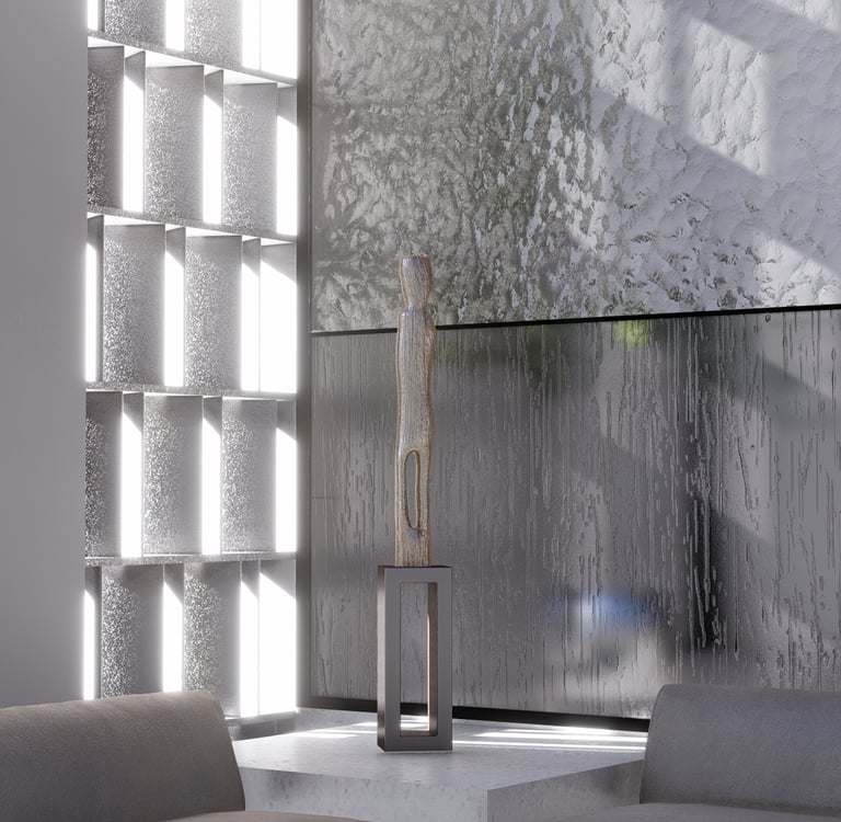 The arrangement of gray sofas and a standing sculpture in front of a modern, textured wall.