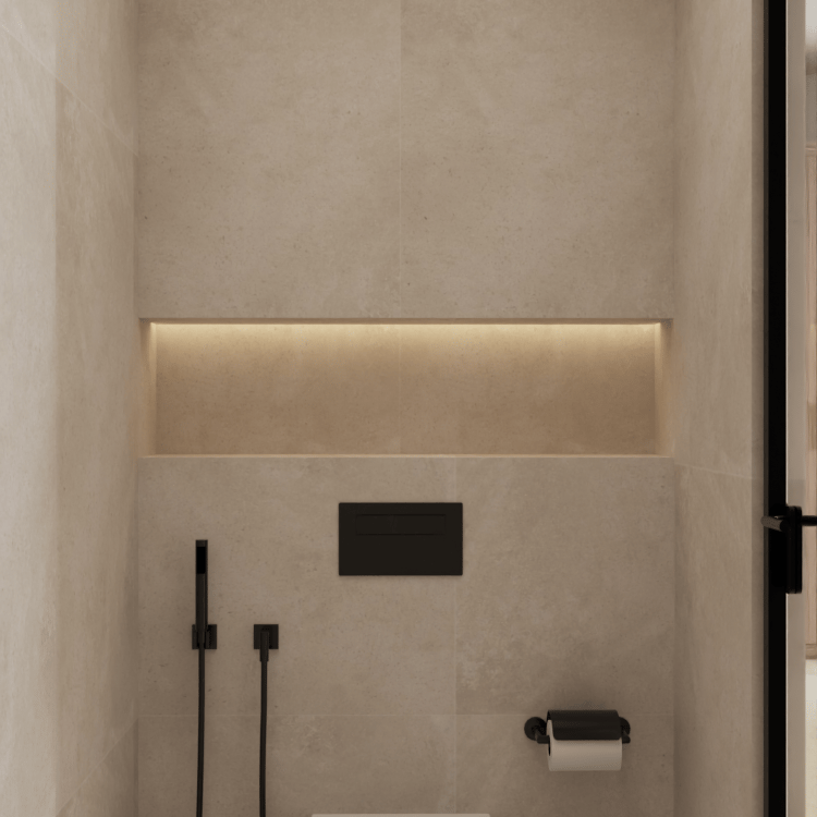 Wall-mounted toilet, bidet, and toilet paper holder in a beige bathroom.