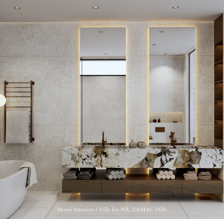 Modern bathroom with double marble vanities, illuminated mirrors, a tub and a heated towel rack
