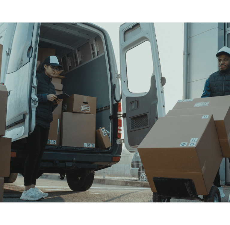a man is moving boxes of boxes into a van