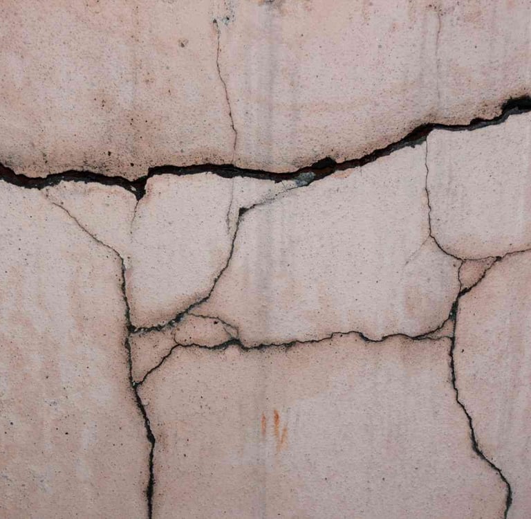 cracked foundation wall in Colorado Springs home showing moisture intrusion damage from repeated freeze thaw cycles creating