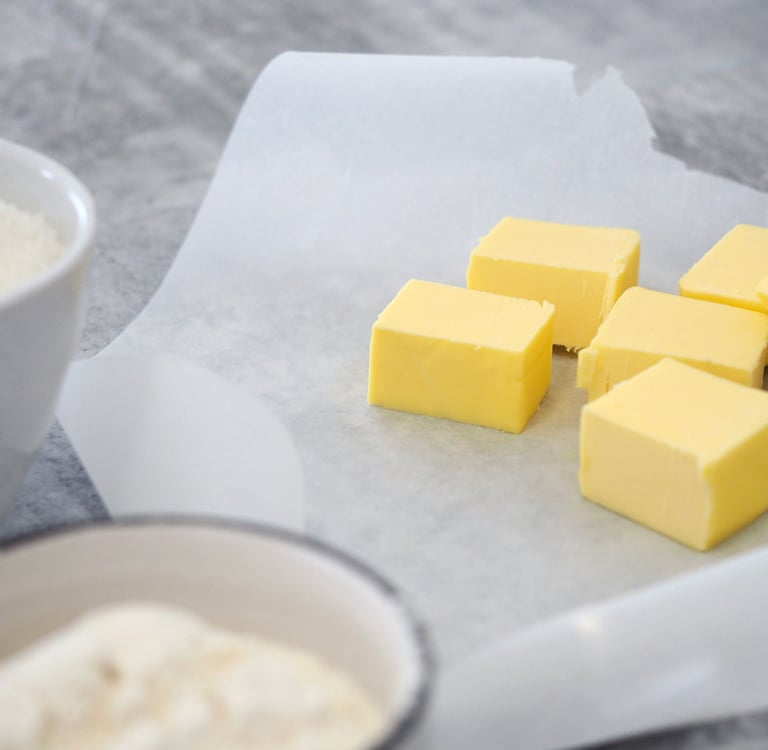 a bunch of butter butter cubes on a table