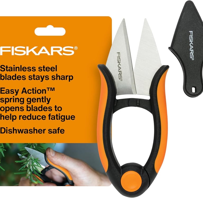 Fiskars herb snips with stainless steel blades, Easy Action spring, and a black safety sheath for precision pruning.
