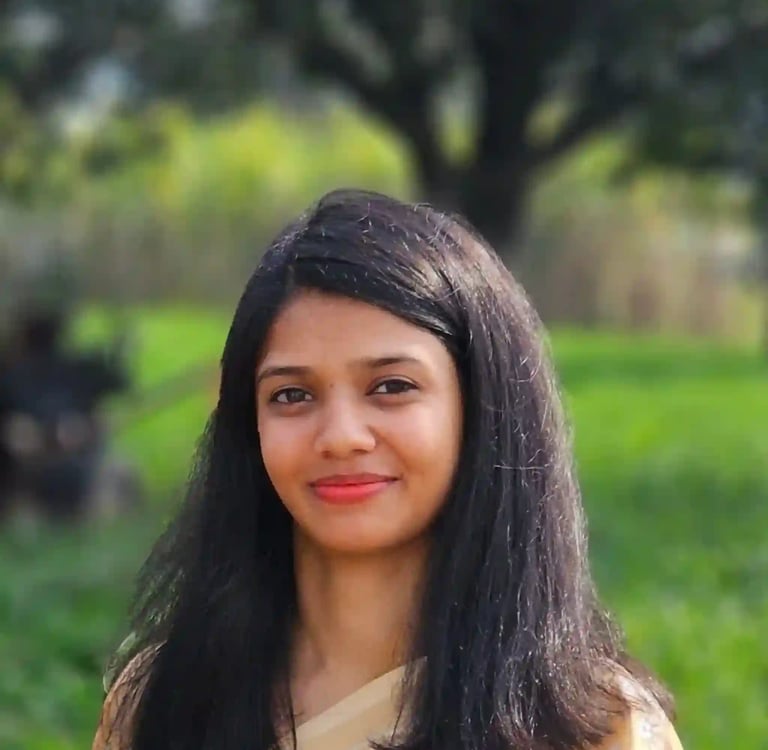 A front-facing portrait of the meditation facilitator.
