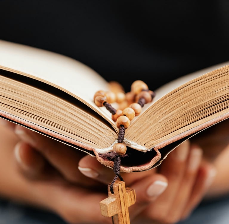Female hands holding a Bible with a beaded bookmark with the word faith in the foreground