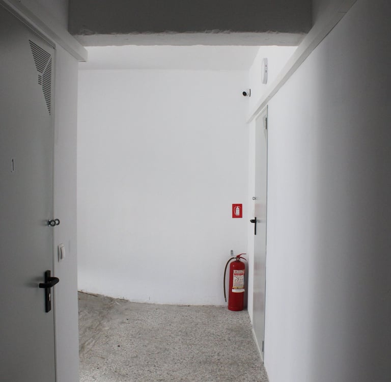Central Corridor with Self Sotrage Doors and Fire Extinguisher