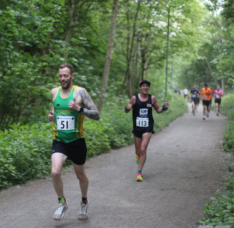 a man running on a path in a wooded area