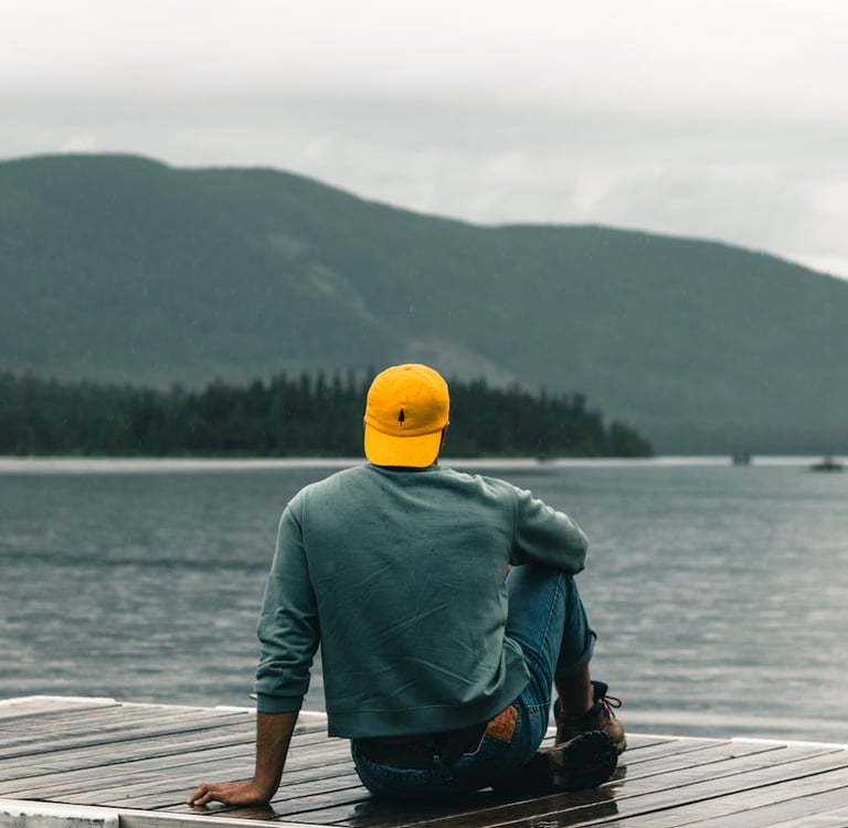 Photo by Ali Kazal: https://www.pexels.com/photo/man-sitting-on-a-promenade-and-looking-at-the-horiz