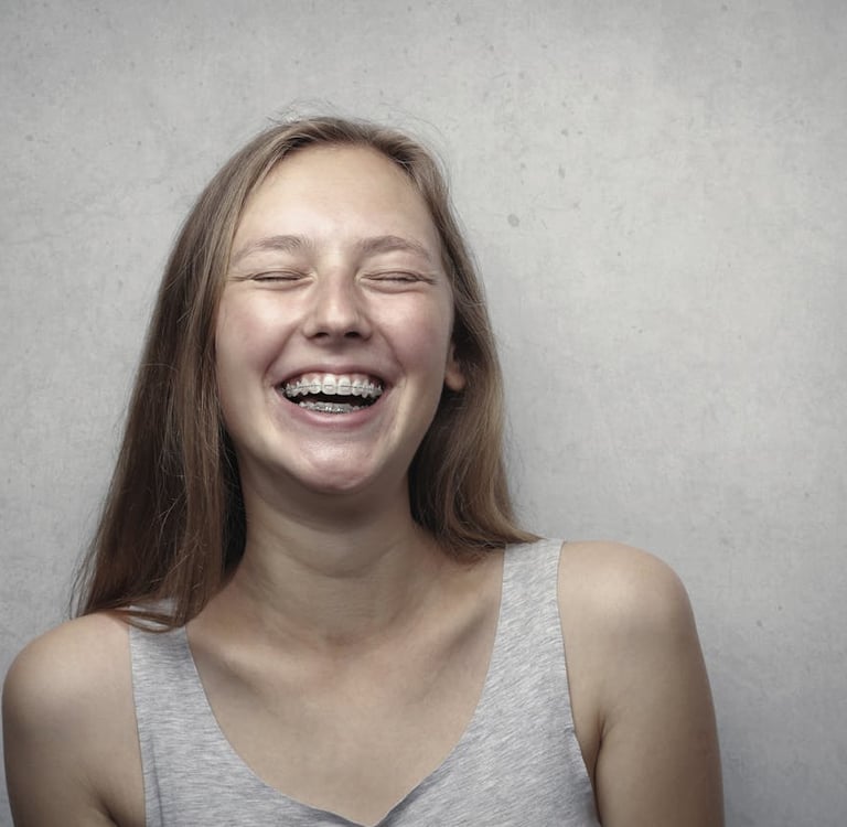 Photo by Andrea Piacquadio: https://www.pexels.com/photo/woman-in-gray-tank-top-laughing-3812740/