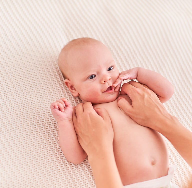 a baby is being held by a woman