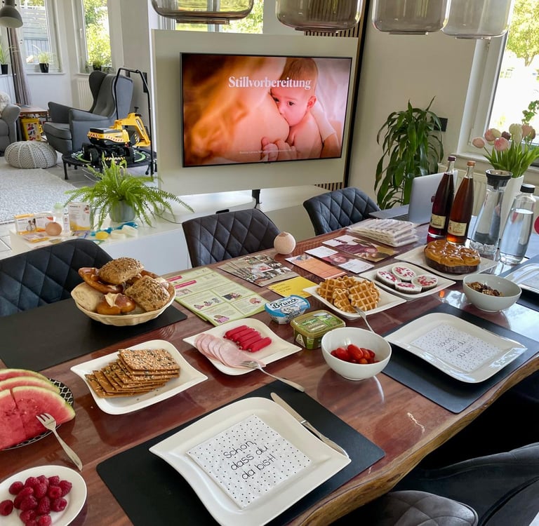 a table with plates of food and drinks