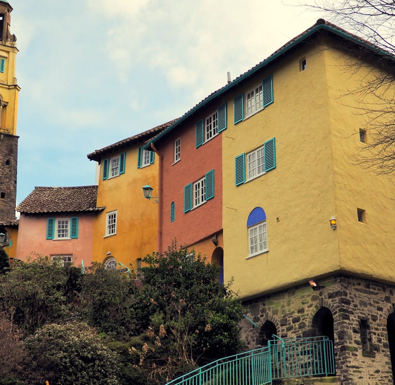Colorful Italian-style architecture and the iconic clock tower in Portmeirion village, North Wales.