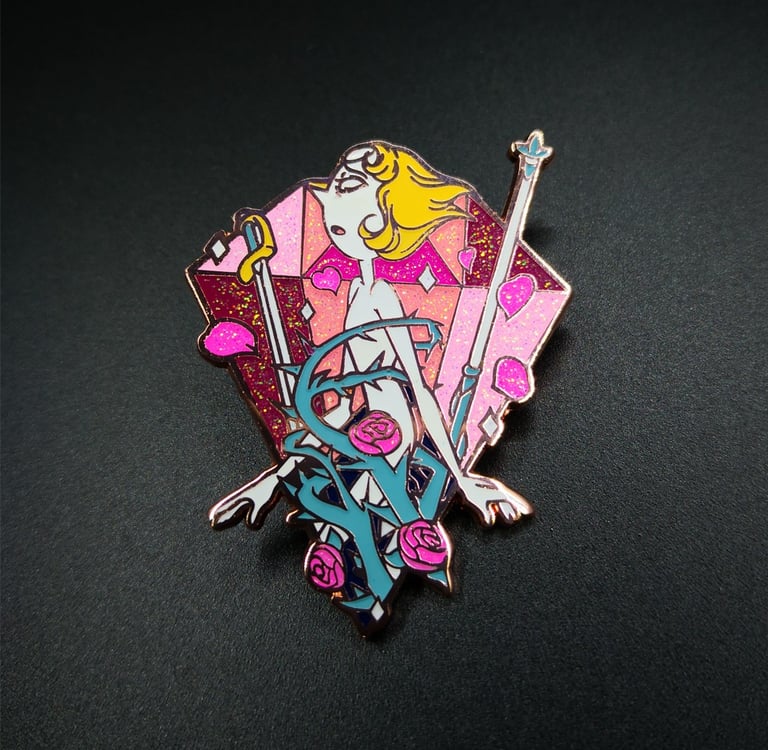 a glittered hard enamel pin