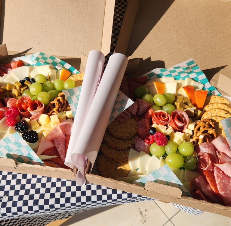 a box of food in a box with a checkered table cloth