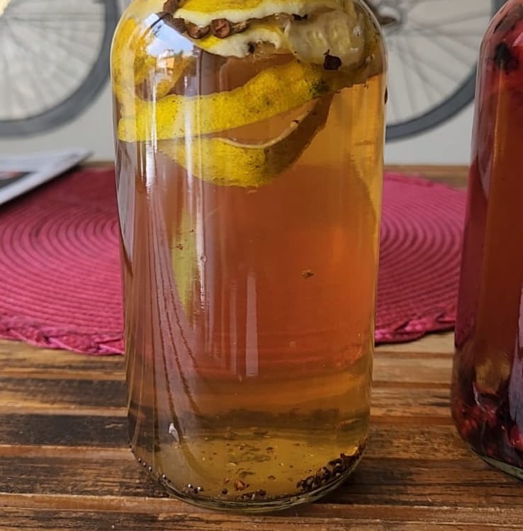 a bottle of kombucha with orange