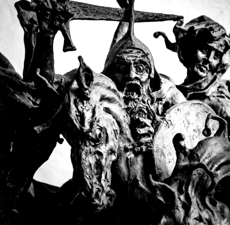 a statue of a man with a sword and a sword the four horsemen of apocalypse