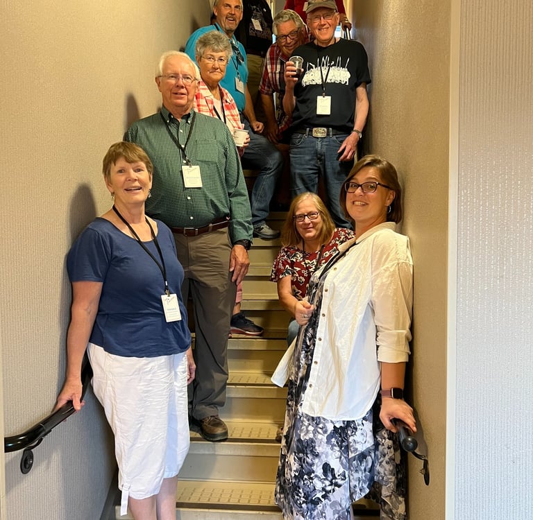 10 telelaget members stand in a stairwell