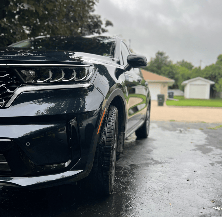 Perfectly washed sports car with sparkling clean windows and body