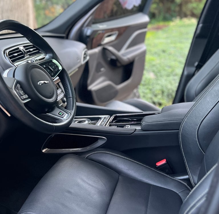 Sanitized SUV interior with clean cupholders and debris-free console