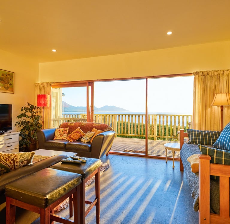 The Cottage open-plan living area with ocean views in Kaikoura