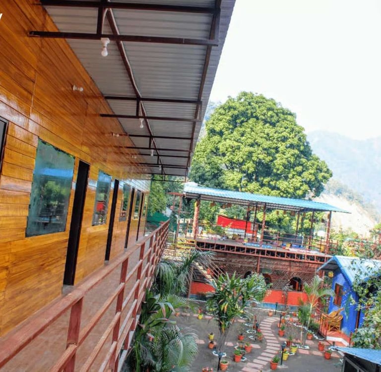 Cottage stay at Jungle Lore Resort with natural ambiance and greenery