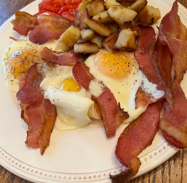 Photo of bacon and eggs cooked by author Robert Ellis for an early supper.
