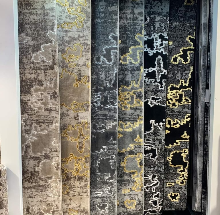 a display of a variety of different types of carpets