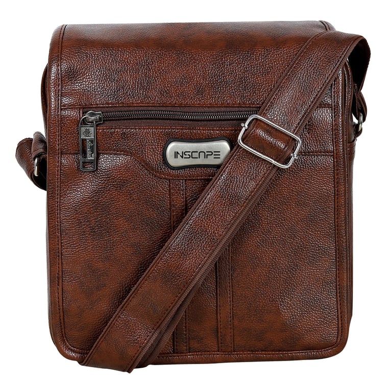 a brown leather sling bag with a silver metal buckle and silver slider