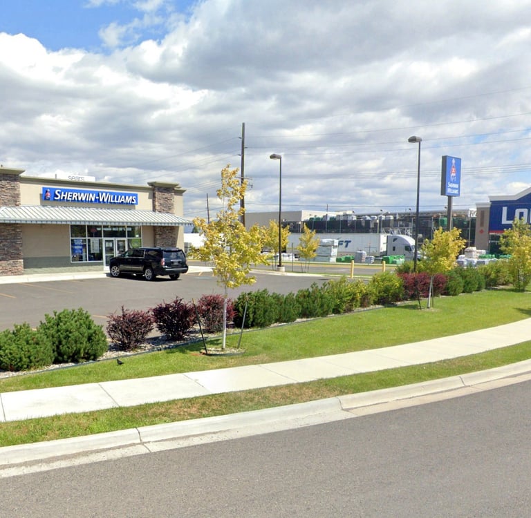 a car dealership with a truck parked in front of it