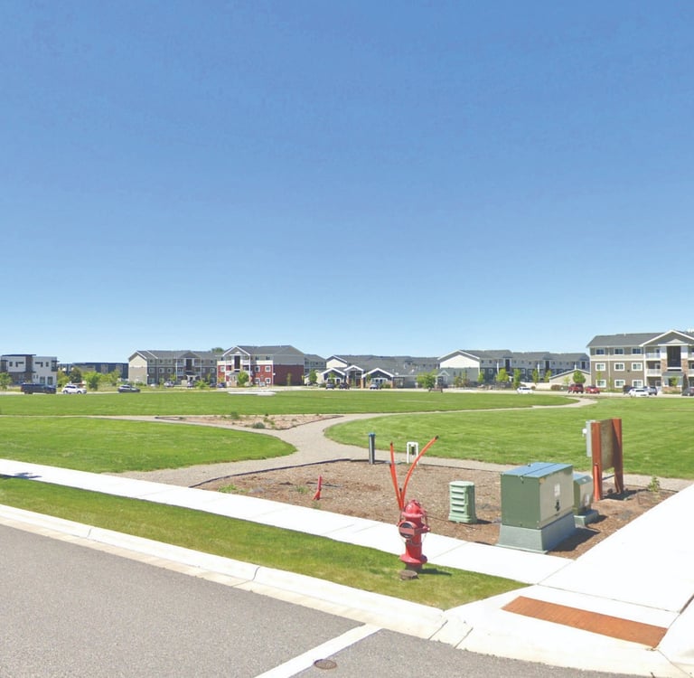 a park with a playground structure and a playground structure