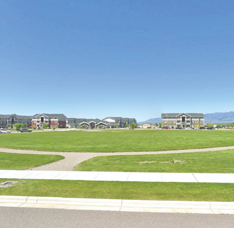 a park with a circular shaped lawn and a circular shaped lawn