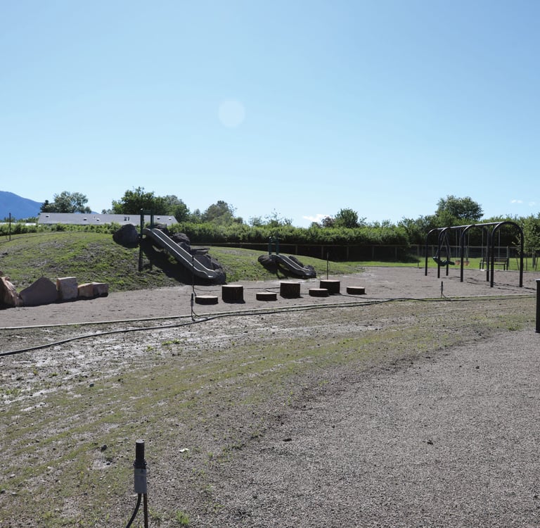 a playground with swings, swings, and swings
