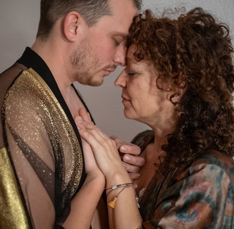 a man and woman holding hands in an embrace