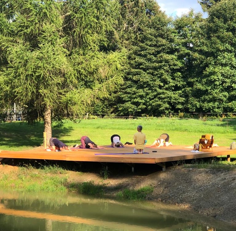 yoga outdoors in garden with sun at yoga retreat