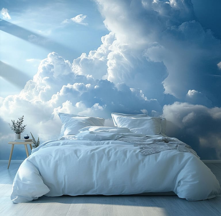 Modern bedroom with white bedding and a large wall mural of fluffy clouds and blue sky.