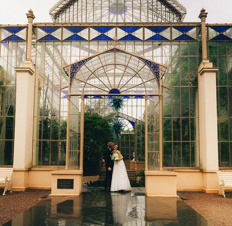 Bride and groom portrait outside the Adelaide Botanic Garden glasshouse
