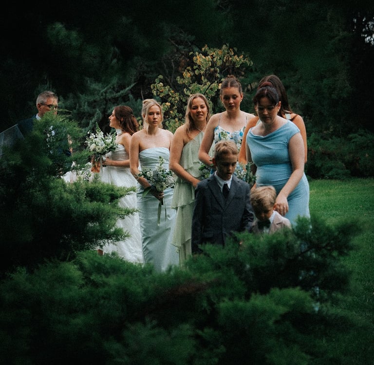 Wedding guests walking through Adelaide Botanic Garden before the ceremony