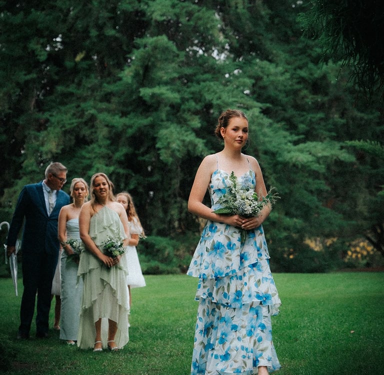 Bride walking down the aisle at Araucaria Avenue in Adelaide Botanic Garden