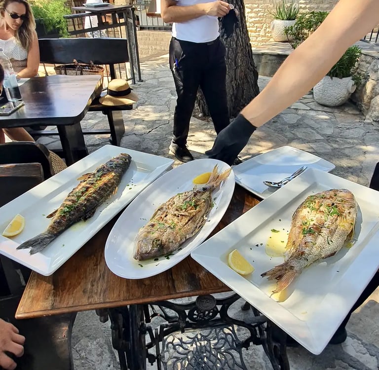 Wild Adriatic 1st class fish: sea bream, sea bass and toothfish freshly served at seaside restaurant in Sesula Solta.