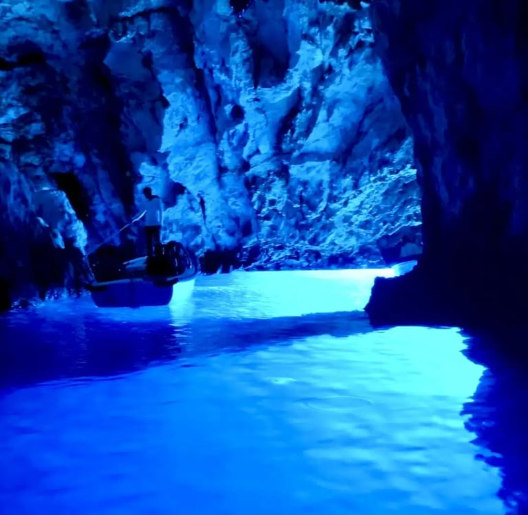 Interior view of the Blue Cave on Bisevo Island, Croatia, showcasing the vibrant glowing blue waters