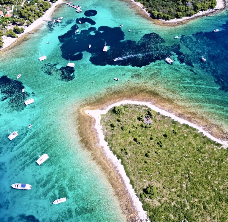 Aerial panoramic view of Blue Lagoon at Drvenik Veliki Island, seen on a private boat tour from Split, Croatia.